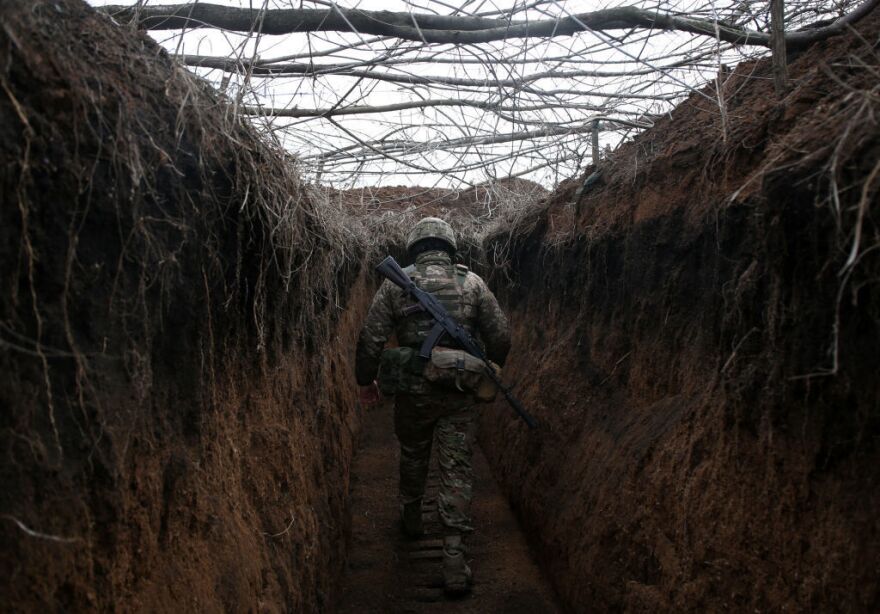 A serviceman of Ukrainian Military Forces walks along a trench on the front line with Russia-backed separatists not far from Novolugansk, Donetsk region, on Feb. 16.