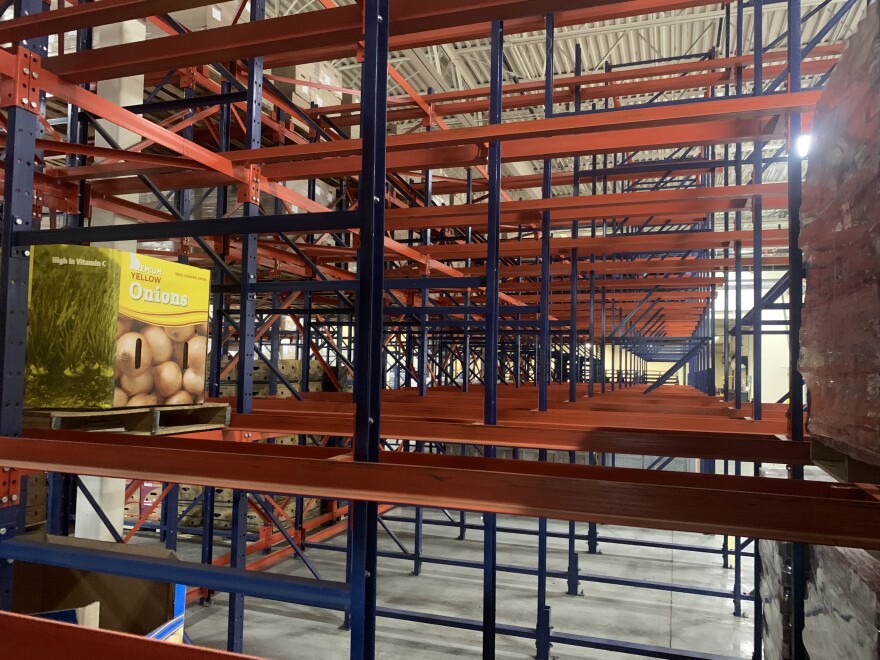 Empty shelves at the Rhode Island Community Food Bank, which now faces a big surge in demand from local food pantries because of a surge in demand during the government shutdown.