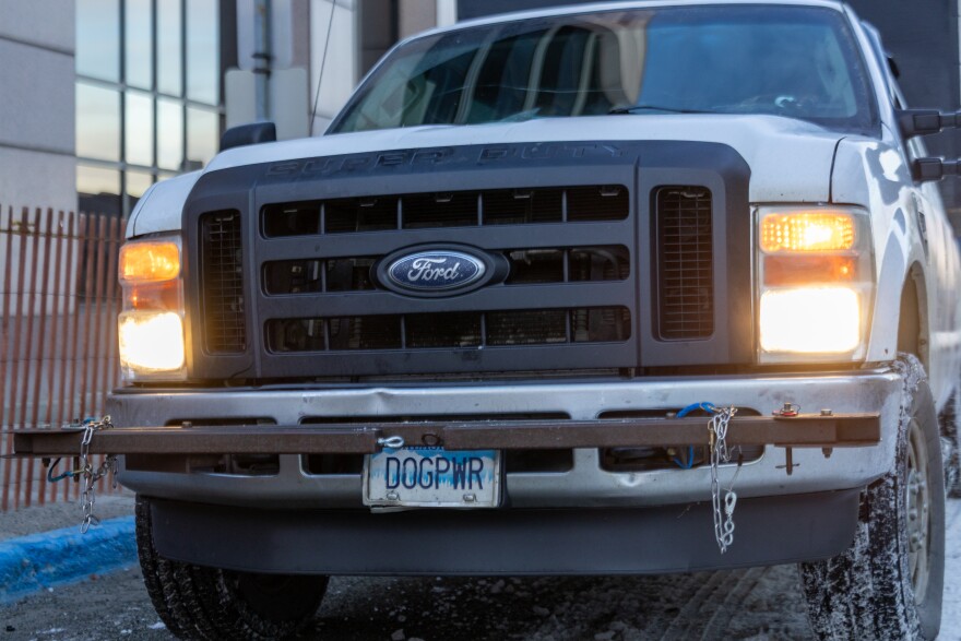 A license plate on a dog truck reads "DOGPWR" at the 2025 Iditarod Trail Sled Dog Race in Anchorage.