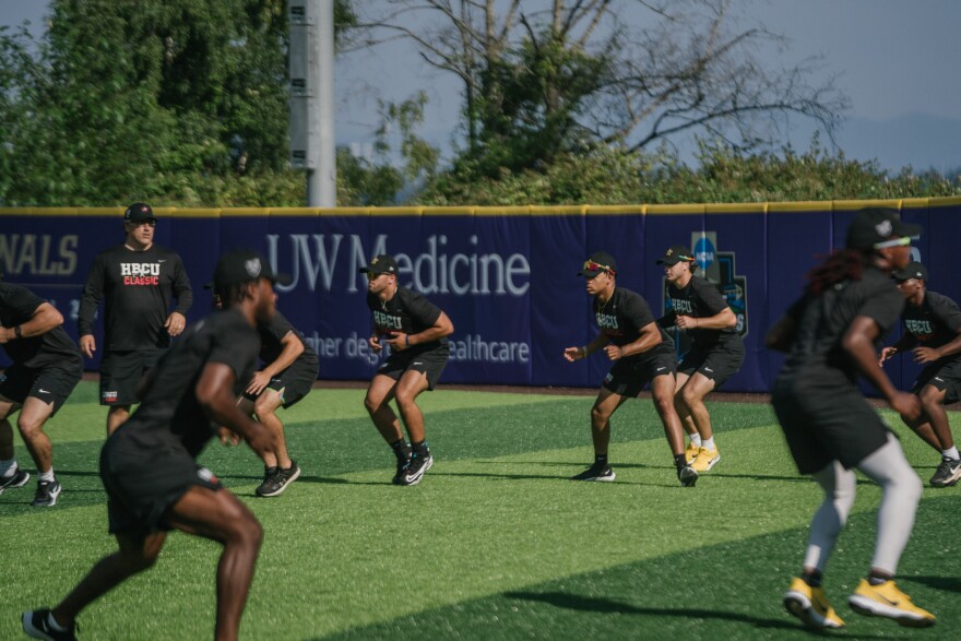 The players selected for the HBCU Swingman Classic went through warm-up drills at the University of Washington baseball stadium on the day before the game.