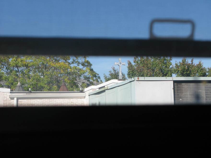 The steeple of the church next door can be seen through an upstairs window in Slack's house.