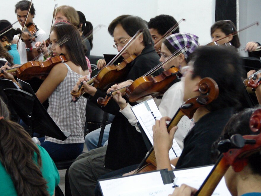 L.A. Philharmonic violinist SuLi Xue sits in with El Sistema students at the Simon Bolivar Conservatory in Caracas, Venezuela.