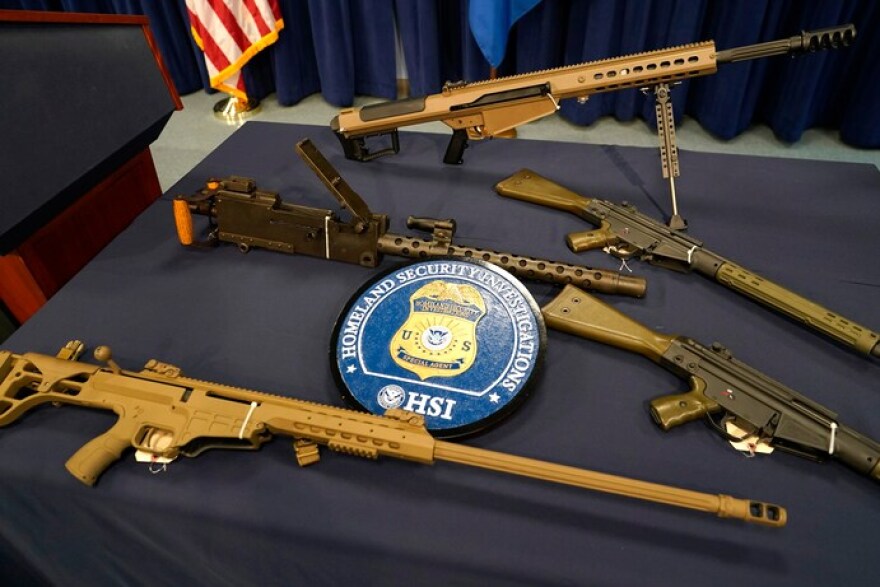 Some of the high-powered military-style rifles Homeland Security Investigations on Wednesday said were recently seized enroute to Haiti.