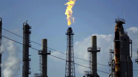 A flame burns at the Shell Deer Park oil refinery in Deer Park, Texas. 