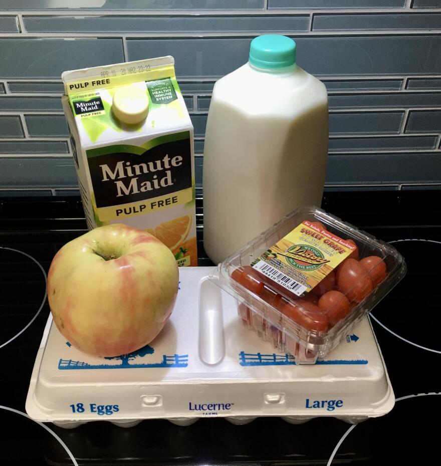milk, eggs, orange juice on counter