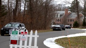 Law enforcement vehicles parked outside Fotis Dulos' Farmington home on Tuesday, January 28, 2020.