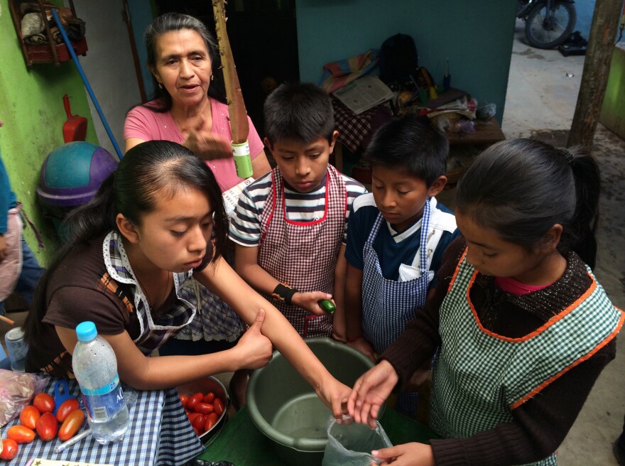 Children learn to cook at Prodesenh, a community center in San Mateo Milpas Altas, Guatemala.