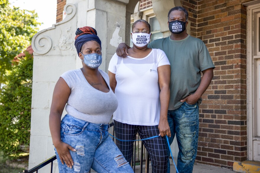 Heavenly Pettigrew, left, and her parents Stephanie and Robert outside their two-bedroom rental apartment in Milwaukee. Without assistance from the nonprofit Community Advocates, the family likely would have faced eviction after the pandemic forced Robert and Heavenly out of their steady jobs.