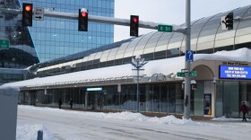 several red lights at a snowy intersection