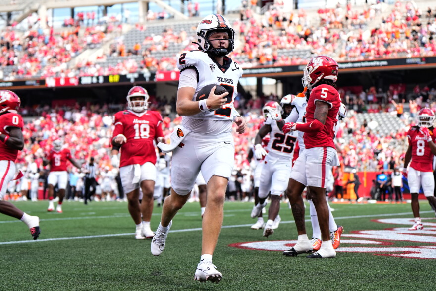 Oregon State Beavers quarterback Braden Atkinson (2) scores a touchdown during the first half of an NCAA college football game against the Houston Cougars in Houston, Saturday, Sept. 5, 2026.