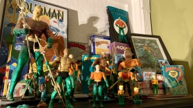 The author's collection of aqua-memorabilia. (Not pictured: The author's many, many Aquaman t-shirts. And the Aquaman tattoo on the authorial left deltoid.)