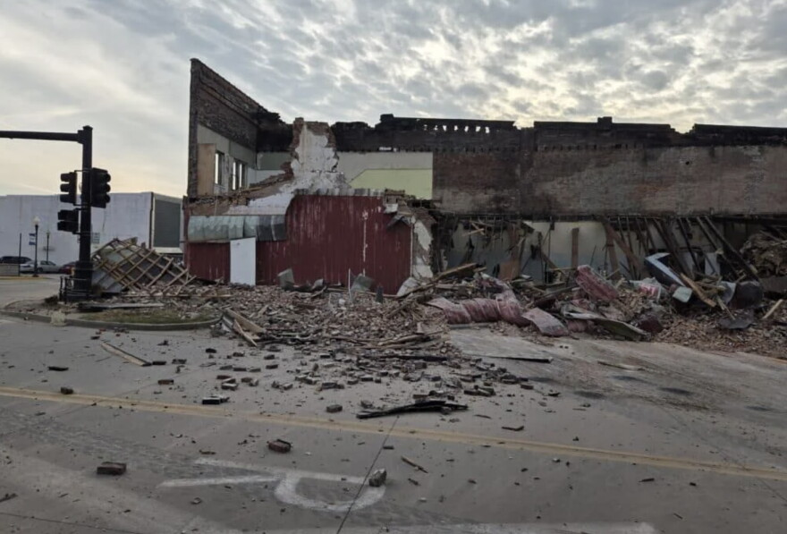A building in Sedalia partially collapsed, leaving debris on the roadway.