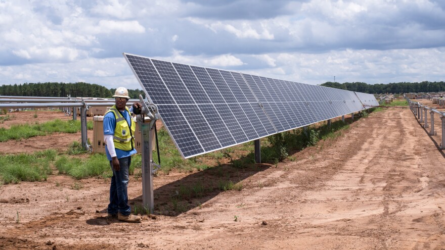 A row of solar panels is installed at Silicon Ranch's latest project outside Blakely, Ga. This 102.5-megawatt power plant will generate electricity for Facebook's new data center in Newton County, Ga., 200 miles away.