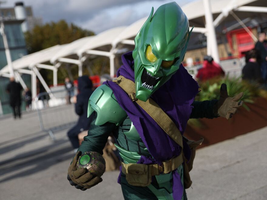 A cosplayer dressed as the Green Goblin poses for a photograph on arrival to attend the MCM Comic Con at ExCeL exhibition centre in London on October 28, 2022.