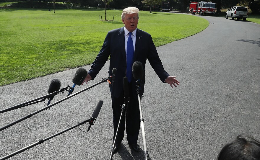 President Trump speaks to the media before leaving the White House to speak with electrical workers in Philadelphia.