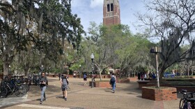 Students on campus at the University of Florida walking through Turlington Plaza as they wait to hear if the University will completely transition to online classes in the wake of the coronavirus. (Photos by Cayela Cuevas/WUFT News)