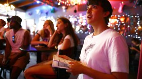 Immigration rights activist Angel Ulloa views a Democratic debate broadcast during a debate watch party on June 26, 2019 in El Paso, Texas. (Mario Tama/Getty Images)