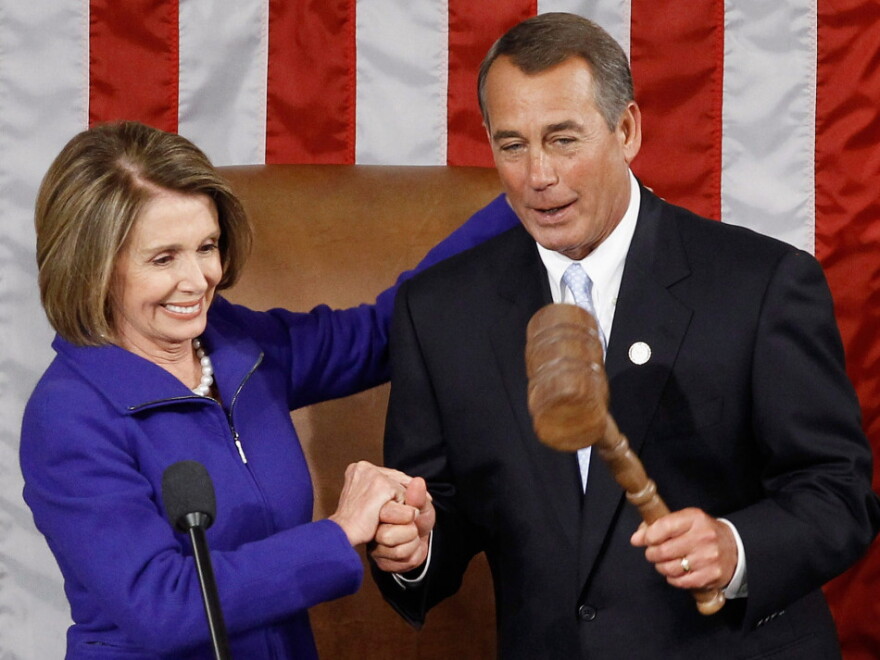 Newly minted Speaker of the House John Boehner (R-OH) receives the speaker's gavel from outgoing speaker Nancy Pelosi (D-CA).