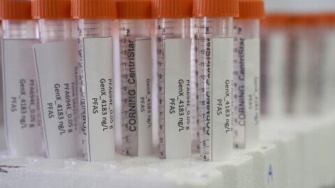 Vials containing PFAS samples sit in a tray.