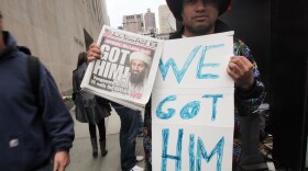 Ray Maldonado holds a 'We Got Him' sign outside the World Trade Center site. President Barack Obama announced the death of Osama bin Laden, accused mastermind of the Sept. 11 attacks late Sunday evening.