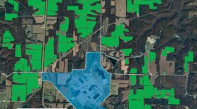 An aerial map of the Callaway County nuclear power plant. The area with nuclear infrastructure is shaded blue. Clusters of the map around the plant are shaded green, showing where solar panels would be built. 