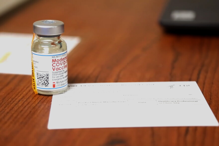 A vial of Moderna's coronavirus vaccine at a Bloomington vaccination site.