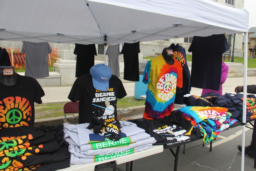 Vendors sell t-shirts at the Bernie Sanders rally in Montpelier.