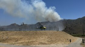 Ventura and Los Angeles County firefighters using helicopters to battle a wildfire off of Highway 126, just east of Piru.