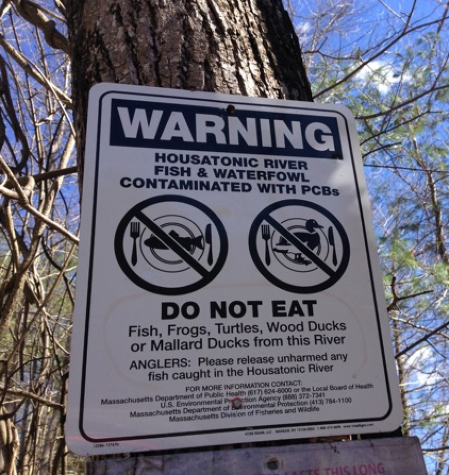 A fish advisory next to a path leading to a fishing spot on the Housatonic River, in a file photo.