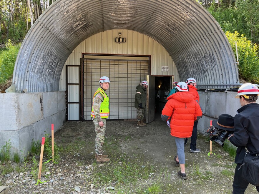 After the groundbreaking ceremony, invitees and others enter the tunnel, which was excavated into a hillside east of the Steese Highway near Fox.