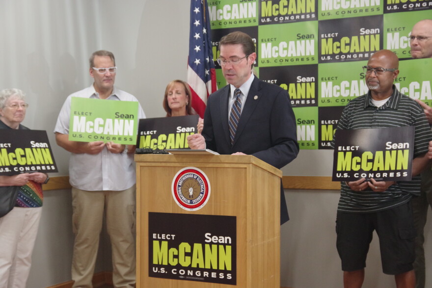 State Senator and 4th district Congressional candidate Sean McCann (center) speaks during a press event at the local offices of the International Brotherhood of Electrical Workers 131 on Friday, August 28, 2026. He was joined by constituents and supporters — as well as IBEW 131 assistant business manager Jonathan Current and former state representative David Maturen, who spoke in his support.