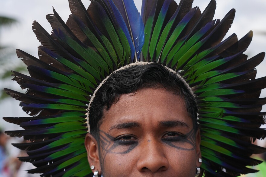 Hamangui, a Brazilian Indigenous activist, poses for a photo outside the venue for the COP30 U.N. Climate Summit, Tuesday, Nov. 11, 2025, in Belem, Brazil. (AP Photo/Fernando Llano)