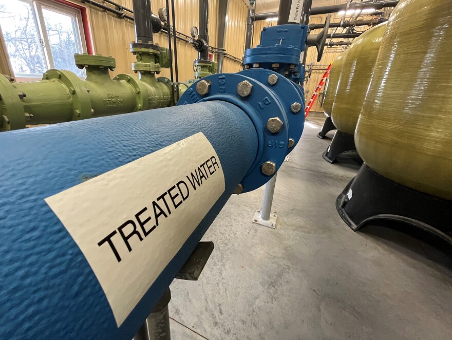 A blue pipe that says "treated water"