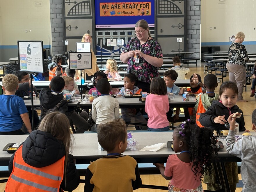 Students eat in the cafeteria of Warren Elementary where Det. Josh Hughes is assigned.