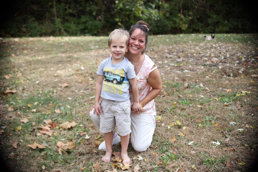 Esther Reddish-Hanner poses with her son.
