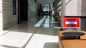 A sign points voters to a polling place inside the Travis County Civil and Family Courts Facility on March 1, 2024.