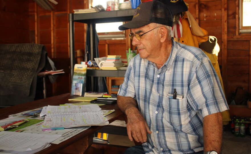 Norm L'Italien looks over his reservations book in a garage at Pelletier's Campground on Sunday, June 28, 2026. "I'm from the old school," he said.