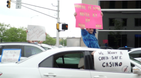 Casino workers hold signs from their cars in downtown Indianapolis.