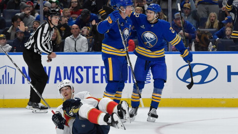 Buffalo Sabres defenseman Rasmus Dahlin, center, celebrates with right wing Jack Quinn, right, after scoring as Florida Panthers center Lars Eller (20) lays on the ice during the first period of an NHL hockey game Monday, Oct. 12, 2026, in Buffalo, N.Y.