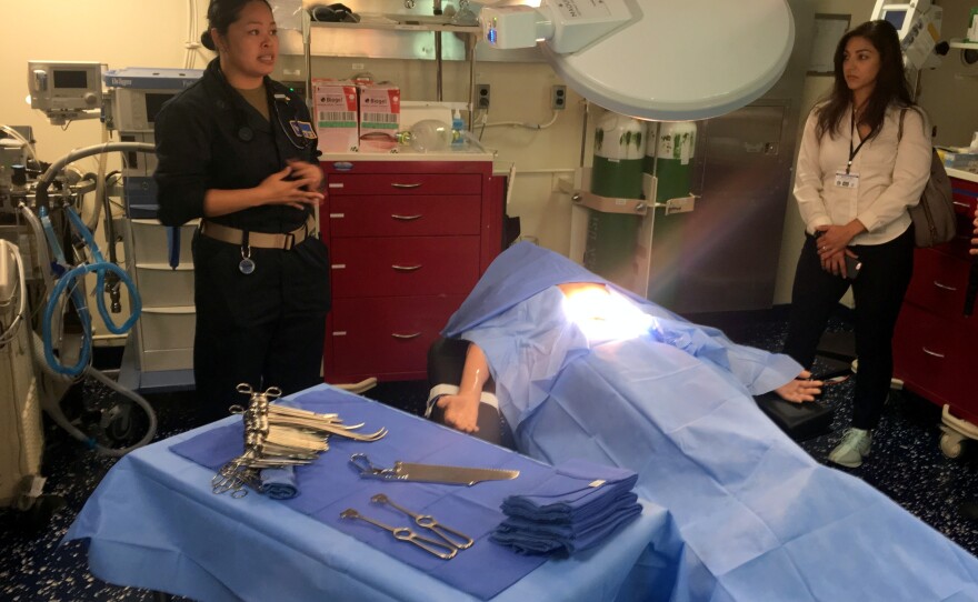 Senior medical officer Maria Gozo, left, stands in one of two operating rooms on board the USS Anchorage.