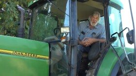 Shelby County, Ohio soybean farmer Chris Gibbs is interviewed while sitting in his tractor.