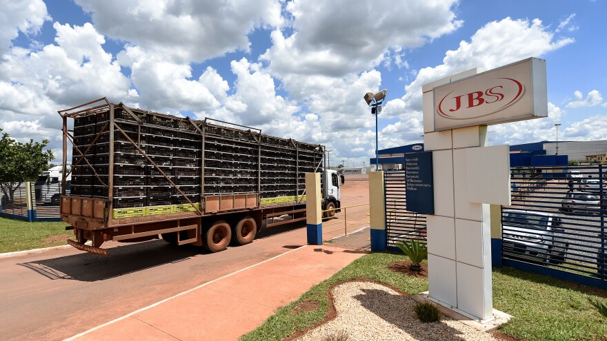 A truck loaded with chickens arrives at a JBS meat processing plant in Samambaia, Brazil, in March.