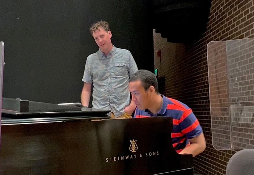 Lansing Symphony Orchestra's composer-in-residence, Patrick Harlin, and guest pianist Clayton Stephenson working out details ahead of debuting Harlin's Piano Concerto titled The Fourth Pedal.