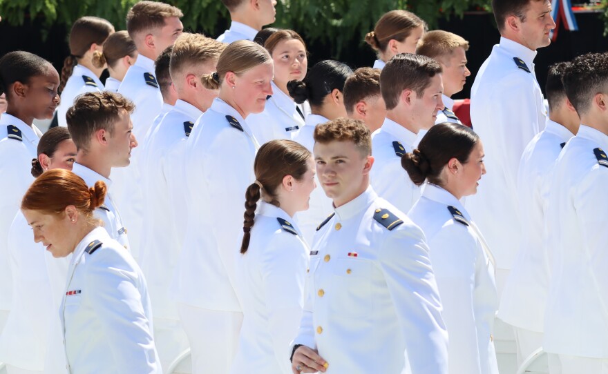Newly commissioned officers celebrate graduation at the U.S. Coast Guard Academy in New London.