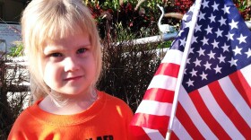 Molly Morath waits to march in the parade honoring MacDill AFB military children. Her dad serves in the maintenance squadron for the 6th Air Mobility Wing.