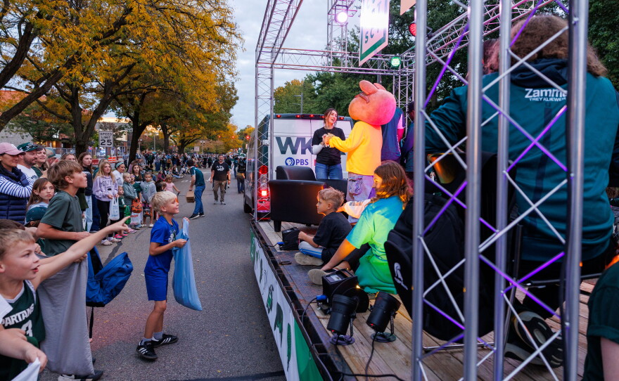 Excited attendees of the Michigan State University Homecoming Parade react to PBS KIDS character Arthur riding on the WKAR float in East Lansing, Mich., on Oct. 9, 2026.