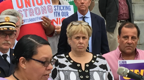 Democratic gubernatorial candidate Ned Lamont stands behind Lori J. Pelletier at a union rally in 2018.
