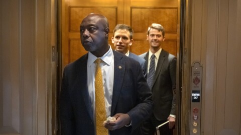 Sen. Tim Scott, R-S.C., steps out of an elevator as Republicans begin a final push to advance President Donald Trump's tax breaks and spending cuts package, at the Capitol in Washington, Monday, June 30, 2025.