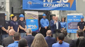 National Power Transformer President Chris Kraft, standing at lectern, outlines the importance of a new $71 million investment.
