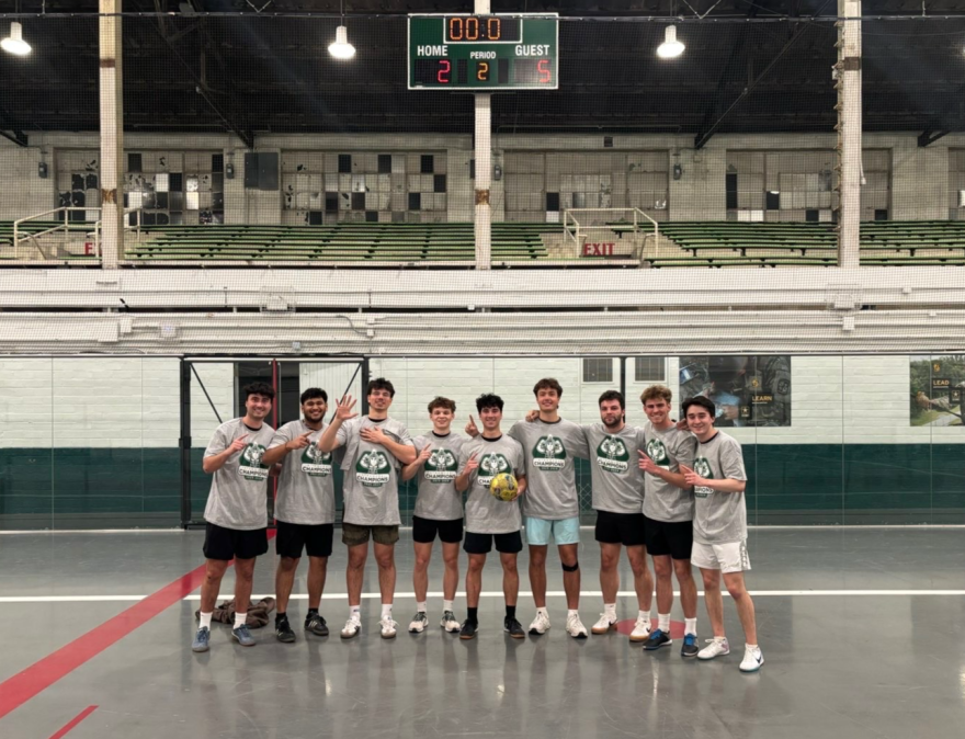 Aaryan Patel (second from left) poses for a photo with his indoor soccer team.